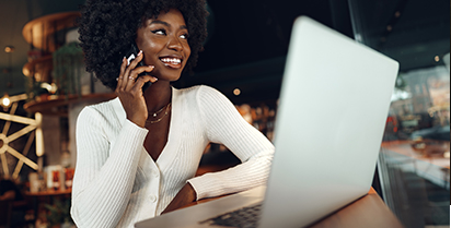 Woman smiling while on her smartphone