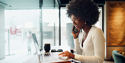 Woman smiling at laptop